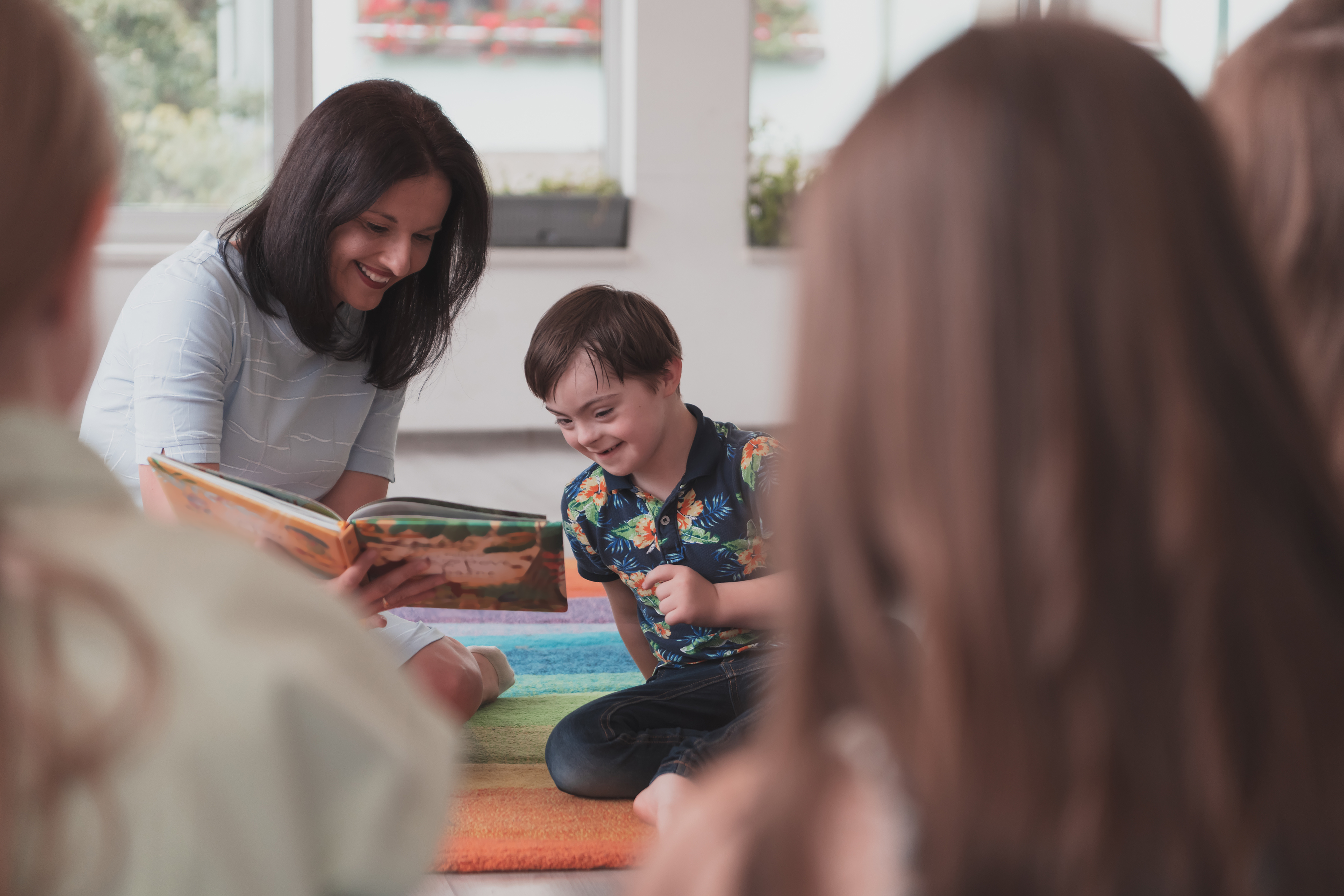 Teacher reading to student